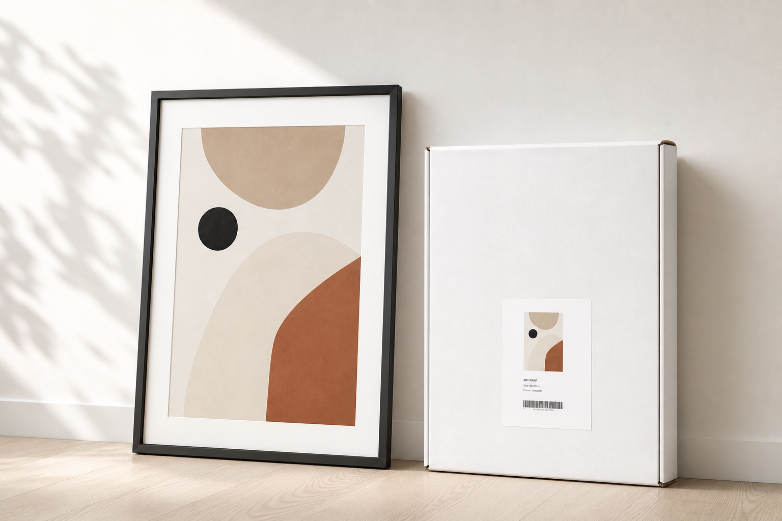 Framed art print next to white-label packaging ready for dispatch from Papello's UK print facility